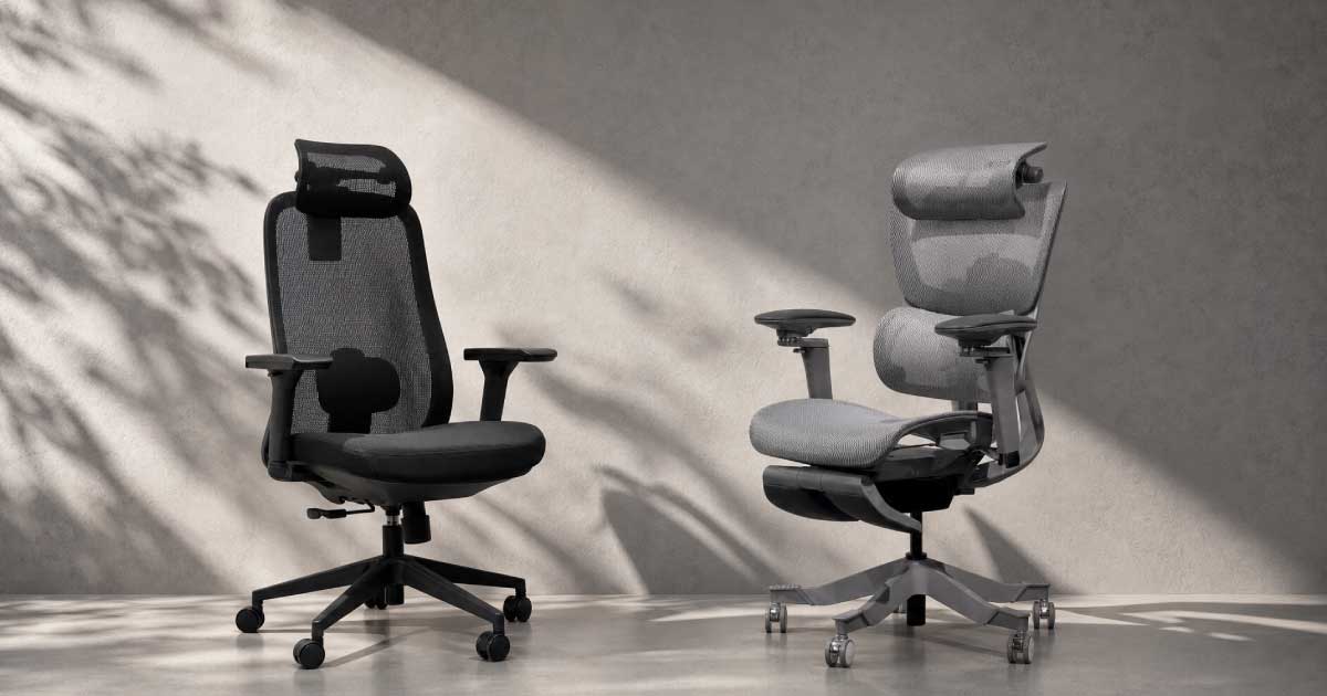 Standard office chair beside an adjustable Niture ergonomic chair