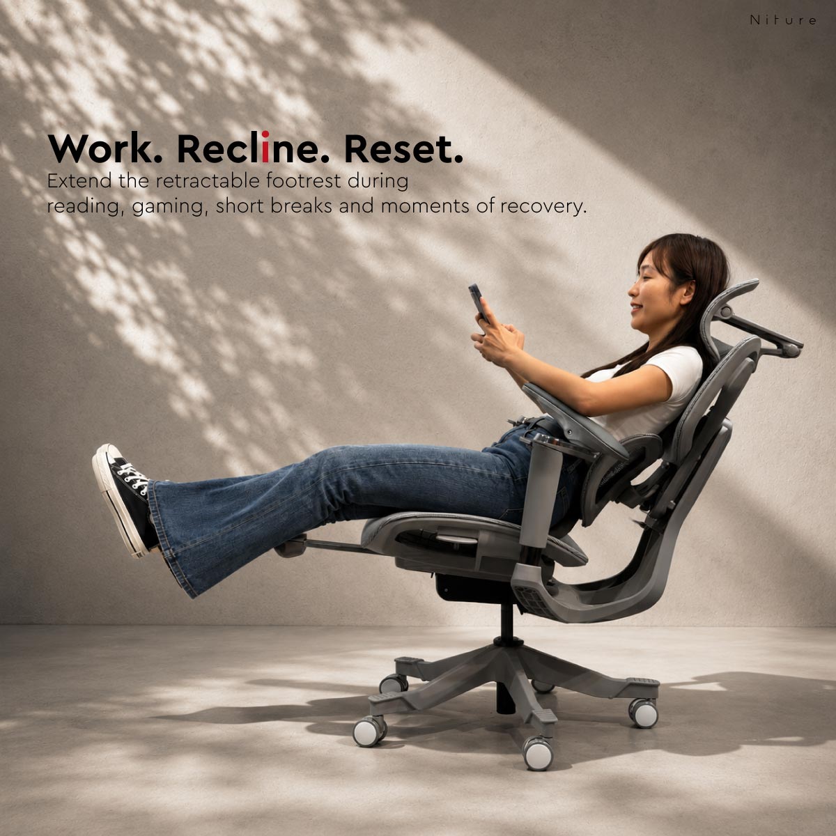 SINC 2 ergonomic chair reclining with retractable footrest extended